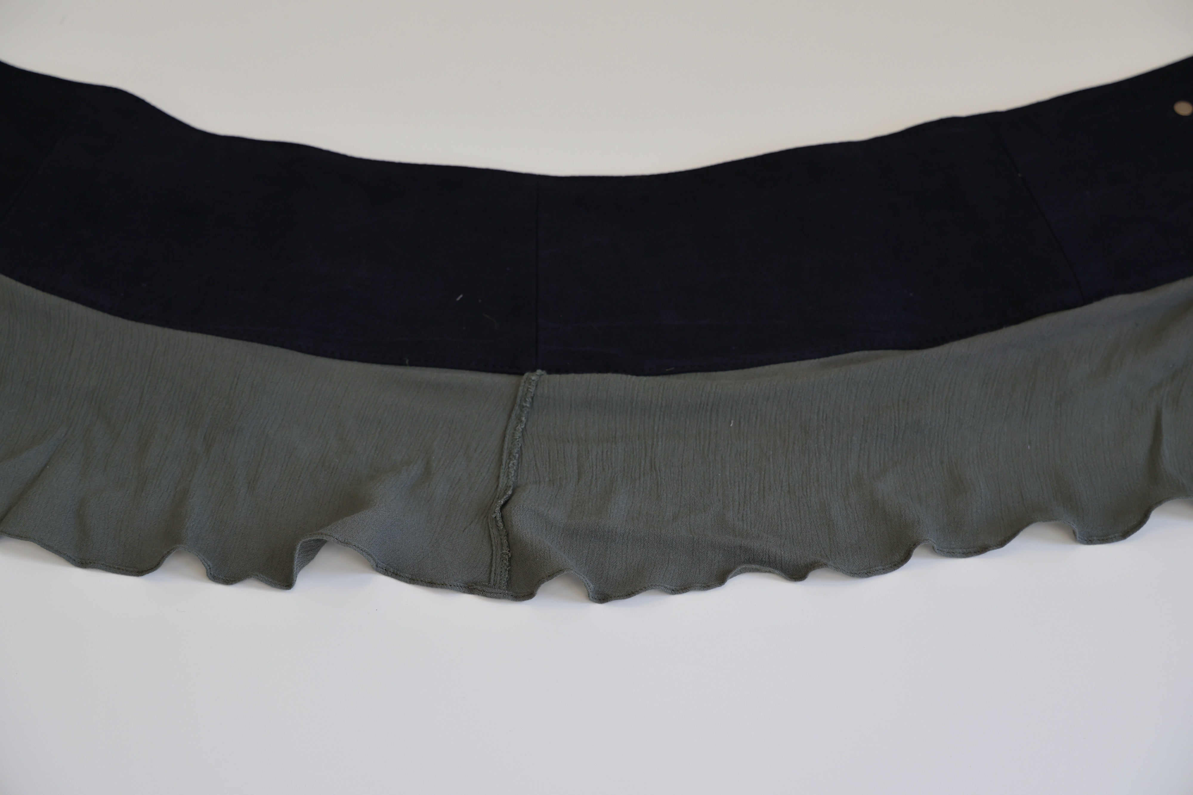 Khaki green with olive trim, bronze button skirt